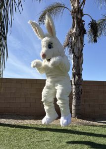 festive easter bunny mascot interacting with families at an easter egg hunt in greater la