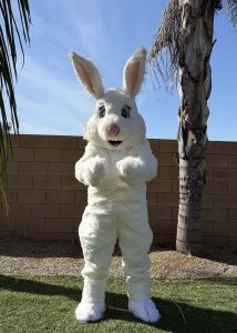 festive easter bunny mascot interacting with families at an easter egg hunt in greater la