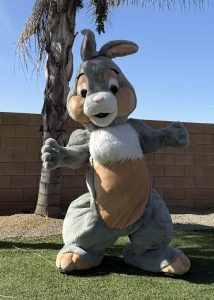 easter bunny mascot waving and greeting guests at a holiday celebration in southern california